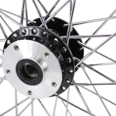 A close up of a Moto Iron® Black Front 40 Spoke Wheel 19" X 2.15" (fits Harley FX, Sportster 1984-1999) Billet Hub on a Harley FX and Sportster motorcycle.