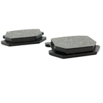 Two black Yamaha XS650 Brake Pads on a white surface.