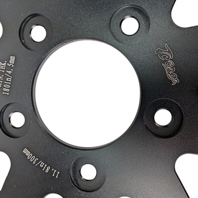 An image of a TC Bros. 11.8in Profile™ Front Floating Brake Rotor for 2006-23 Harley Models on a white background featuring high carbon stainless steel friction material.