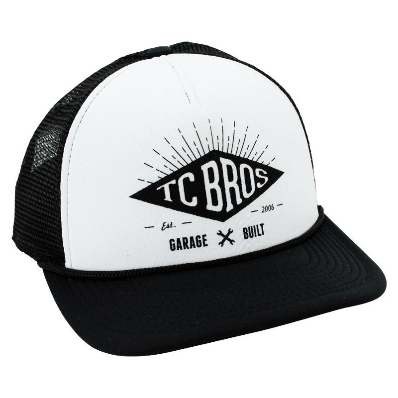 A TC Bros. Diamond Trucker Hat - White/Black with the Black Screen Printed Logo of TC Bros. on it.