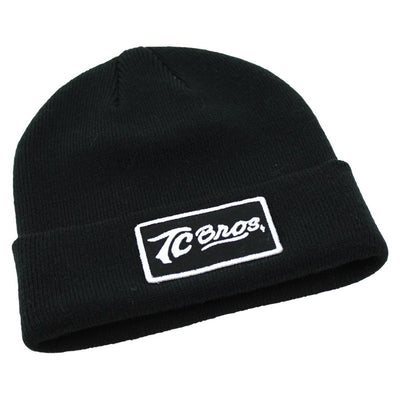 A TC Bros. Classic Beanie - Black with an Embroidered Patch logo on it.