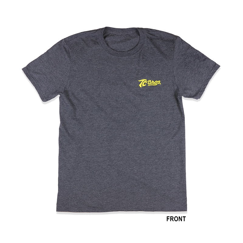 A TC Bros. Shield T-Shirt - Charcoal Heather with a yellow logo on it.
