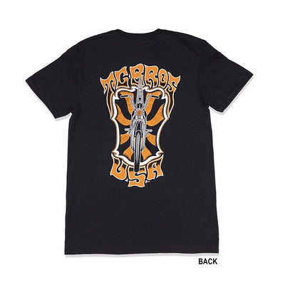 A black TC Bros. Trippin' T-Shirt with an orange and black design.