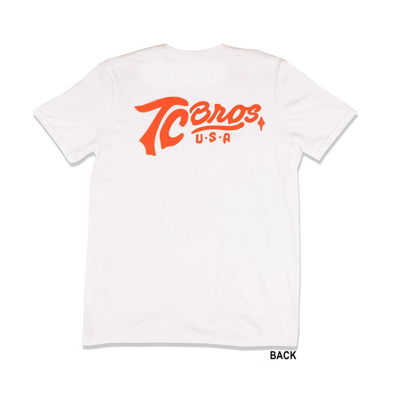 A TC Bros. Classic White T-Shirt with an orange logo on it.