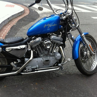 A blue TC Bros. Chrome Louvered Air Cleaner for S&S Super E & G Carbs motorcycle parked on the side of the road.