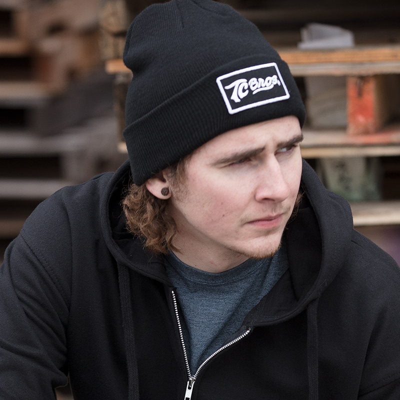 A young man wearing a TC Bros. Classic Beanie - Black.