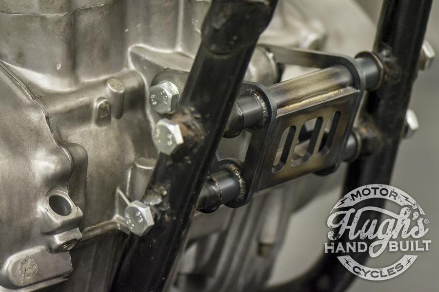 A close-up of a Hughs HandBuilt XS650 Motor Mount Kit (74-Up) motorcycle engine.
