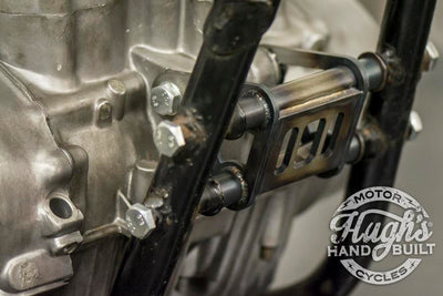 A close-up of a Hughs HandBuilt XS650 Motor Mount Kit (74-Up) motorcycle engine.