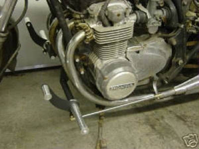 A picture of a TC Bros. Honda CB550-CB500 Forward Controls Kit motorcycle with a silver engine.
