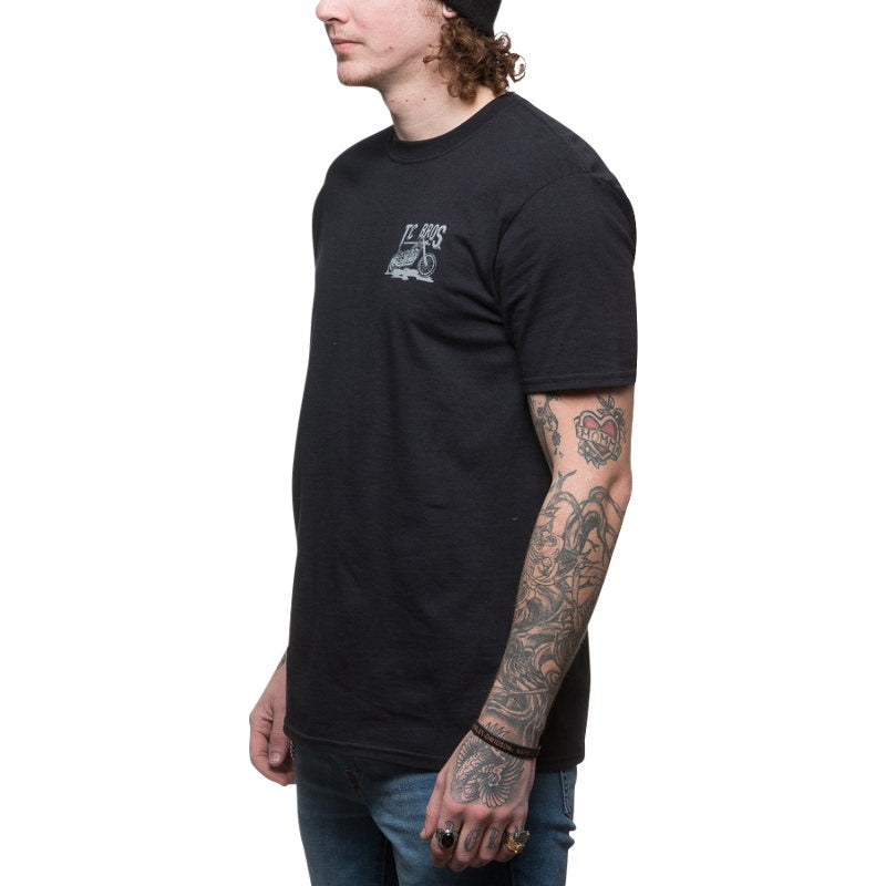 A man wearing a TC Bros. Sketchy T-Shirt - Black from TC Bros.