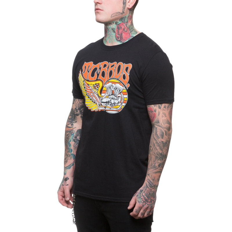 A man wearing a TC Bros. Wing T-Shirt - Black, adorned with TC Bros wing design tattoos.