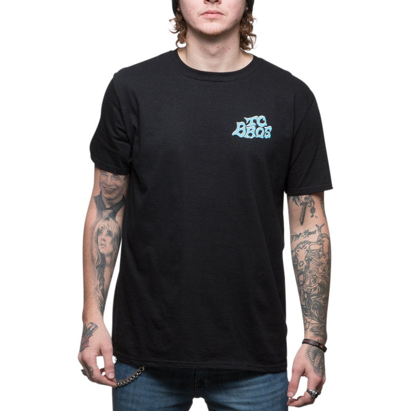 A man wearing a TC Bros. Eagle T-Shirt - Black with tattoos.