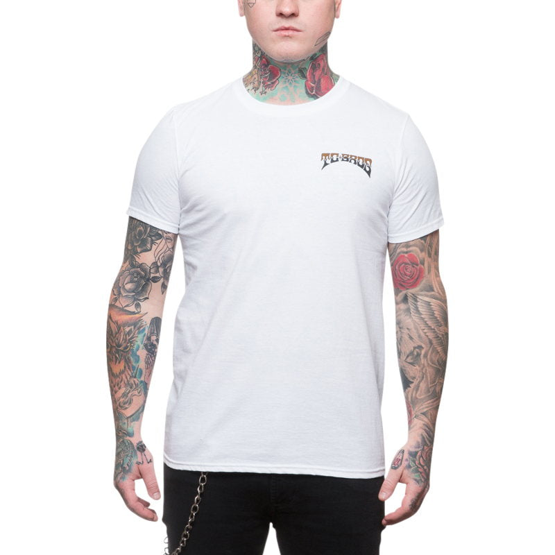 A man wearing a TC Bros. Drifter T-Shirt in white with tattoos is seen.