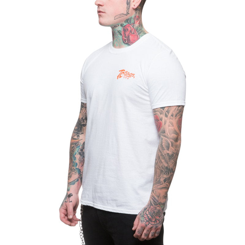 A man wearing a white TC Bros. Classic T-Shirt with tattoos.