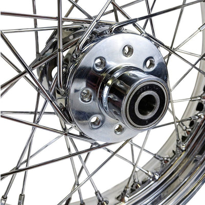 A close up of a Mid-USA chrome rear 40 spoke wheel 16"x3", adhering to OEM specs on a Harley Ironhead Sportster XL from 1955-1978.