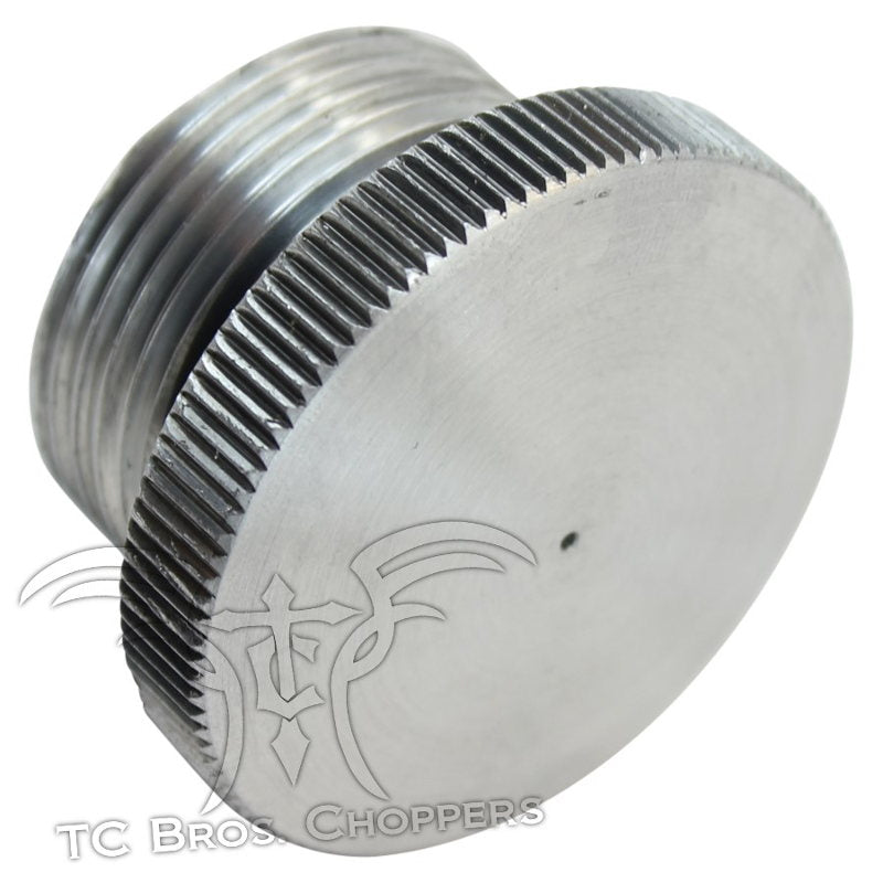 A TC Bros Aluminum Vented Filler Cap with Bung for Oil or Gas Tanks, potentially used in a custom oil tank.
