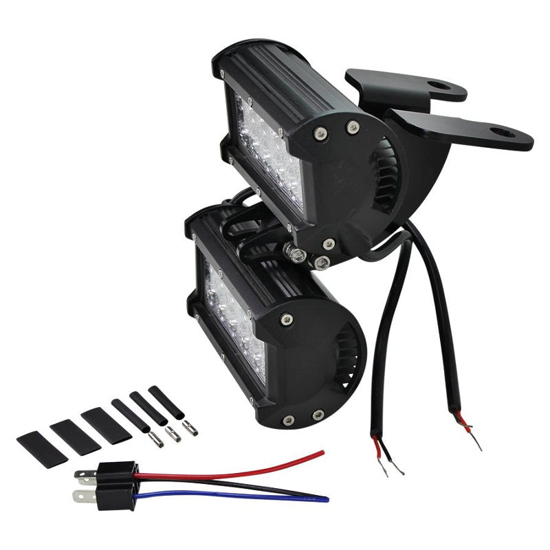 A pair of TC Bros. Scrambler LED Headlight Kit for Harley Davidson - Dual with wires and wires.