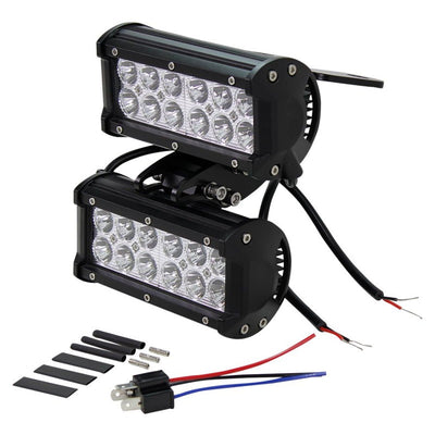 A pair of TC Bros. Scrambler LED Headlight Kits for Harley Davidson - Dual on a white background that dual fits.