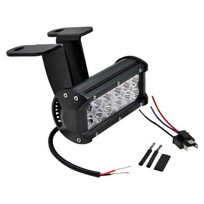 A black LED work light with wires and a TC Bros. Scrambler LED Headlight Kit for Harley Davidson - Single.