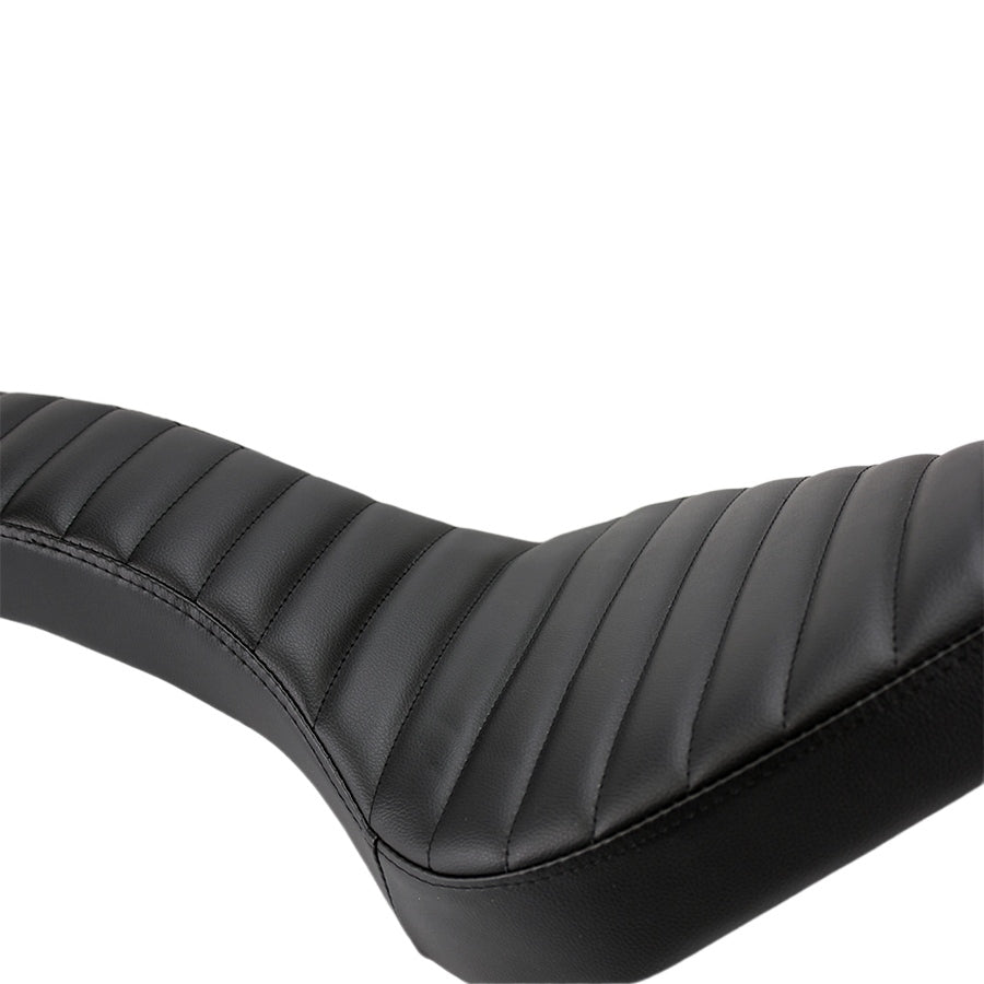 A close up of a black leather motorcycle seat with a TC Bros. Hardtail Rigid Cobra Seat Black Pleated.