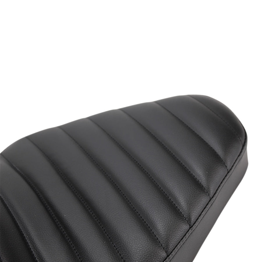 A close up of a TC Bros. Hardtail Rigid Cobra Seat Black Pleated leather motorcycle seat.