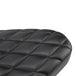 A close up of a TC Bros. Hardtail Rigid Mount Solo Seat Black Diamond chopper solo seat with diamond stitching style.
