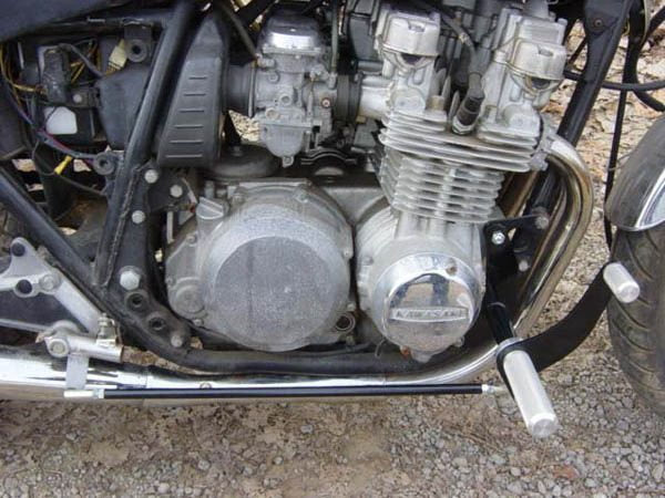 A close up of the engine of a TC Bros. Kawasaki KZ650-KZ750 Forward Controls Kit motorcycle with Forward Controls.