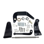 A TC Bros. Mid Controls Kit for 1991-2017 Harley-Davidson Dyna (no footpegs), featuring black metal brackets, assorted bolts, washers, nuts, bushings, and a metal rod arranged on a white background.