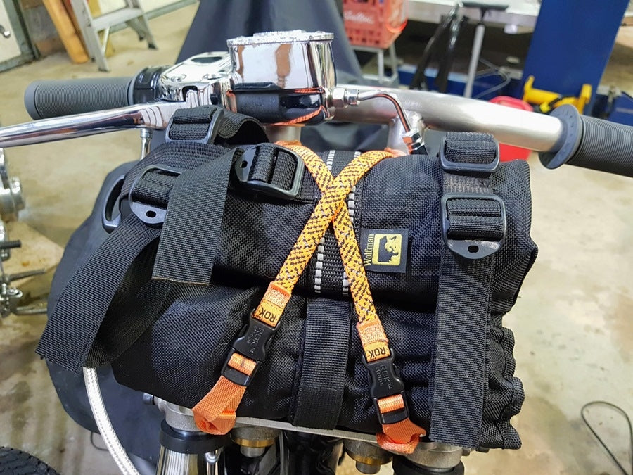 A Pangor Cycles Kneiss Rack Luggage Rack for 1960-Present Harley-Davidson Hydraulic Front Ends attached to the handlebars.