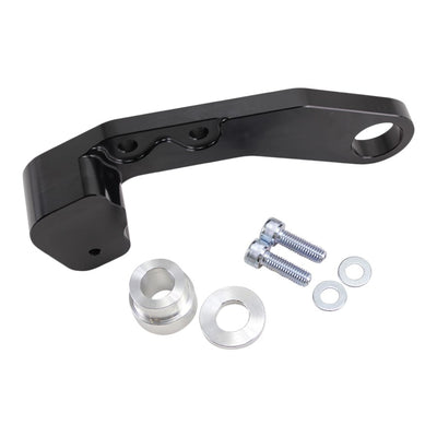 A black TC Bros. bracket with a bolt and nut for a Harley Dyna.