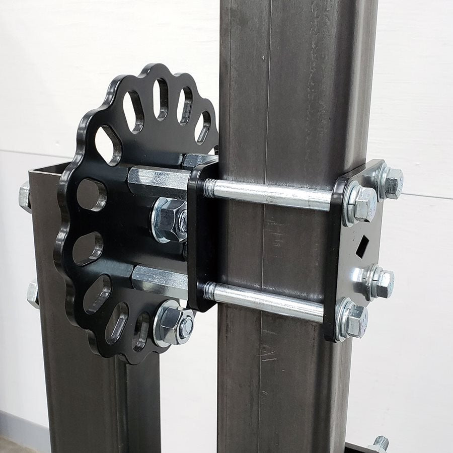 A bolt attaches a metal pole, suitable for motorcycle frame jig, to the DIY Frame Jig Rotisserie Stand by Chop Source.
