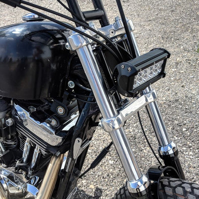 A close up of the front end of a motorcycle featuring a TC Bros. Scrambler LED Headlight Kit for Harley Davidson - Single.