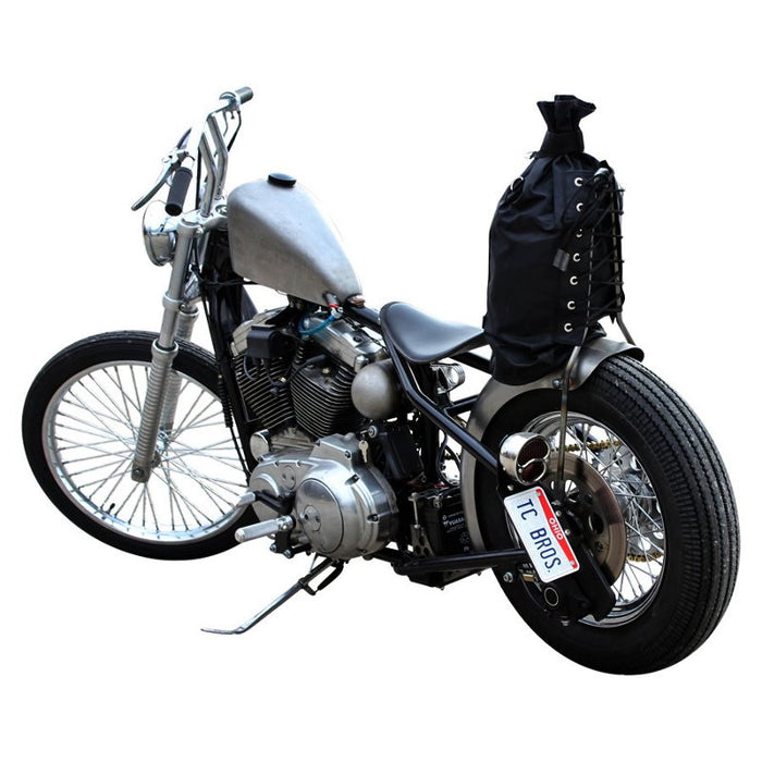 The TC Bros. 1" Whiskey Handlebar features a chrome finish with a raised center and two vertical grips, echoing classic Harley Davidson style, shown here against a white background.