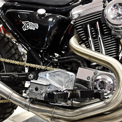 A close up of a TC Bros. Billet Sprocket Cover for 86-03 Sportster - Aluminum attached to it.