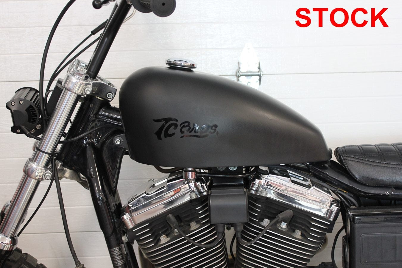 A set of black screws and bolts for a TC Bros. 1995-2003 Sportster 3.5" Frisco Style Gas Tank Lift Kit motorcycle.
