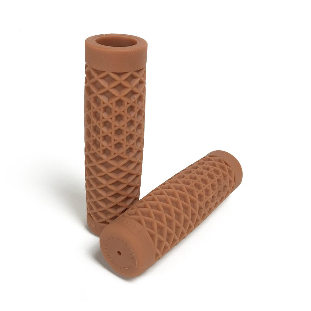 A pair of brown Vans + Cult Motorcycle Grips - 7/8" Gum Rubber on a white background, perfect for ODI enthusiasts.