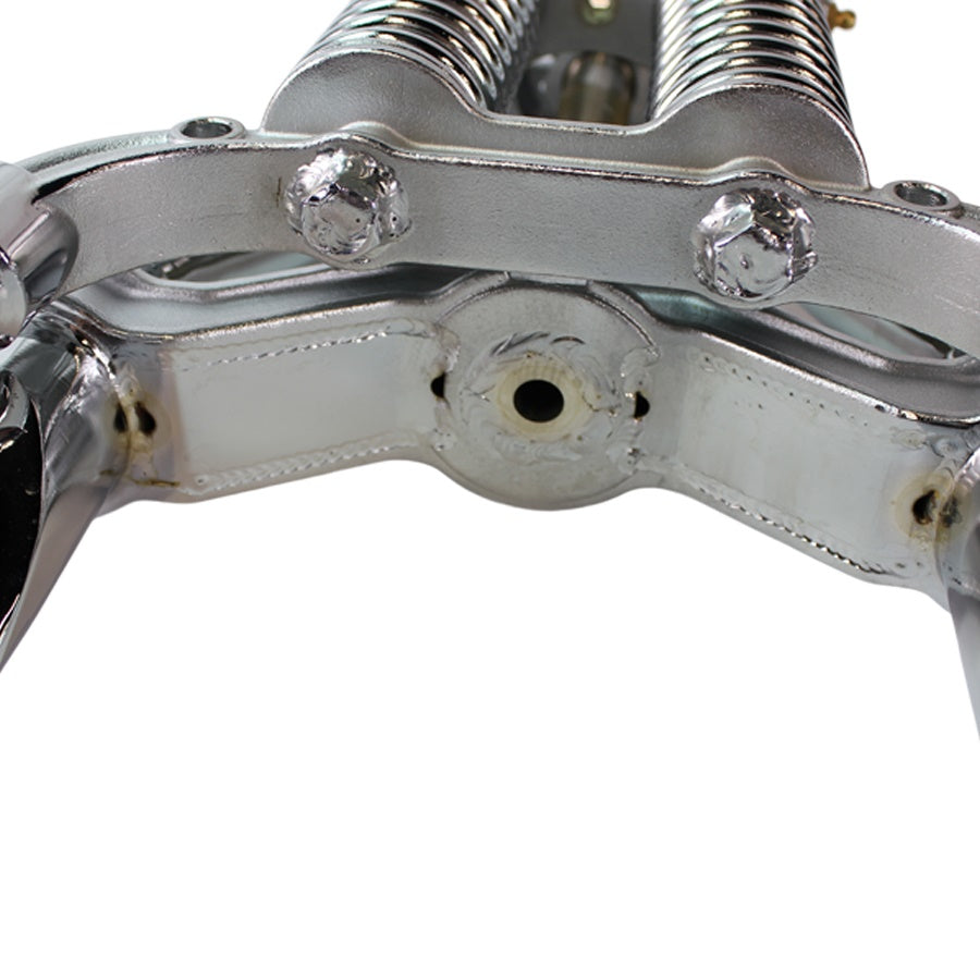 A close up image of a chrome Moto Iron® Vintage Springer Front End -4" Under Chrome fits Harley Davidson cylinder head.