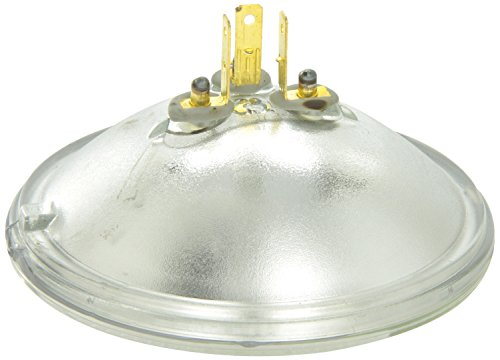 The Wagner H4467 Halogen Replacement Headlight Bulb features a round, clear sealed beam design with a ribbed glass lens and visible filament, shown from the front.