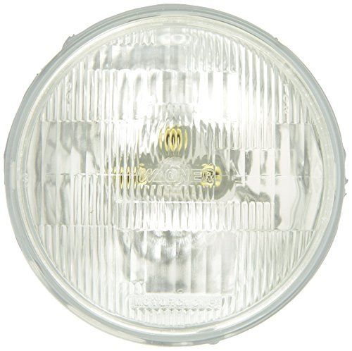 A Wagner Lighting H4467 Halogen Sealed Beam Headlight Bulb upgrade for a motorcycle, specifically for Harley Davidson models, on a white background.