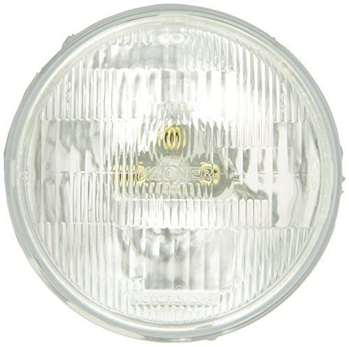 The Wagner H4467 Halogen Replacement Headlight Bulb features a round, clear sealed beam design with a ribbed glass lens and visible filament, shown from the front.