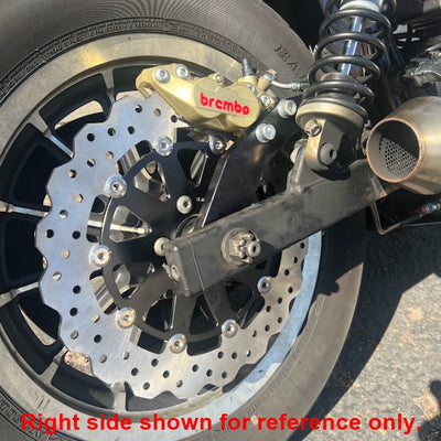 A picture of a motorcycle with a Brembo P4 Axial Brake Caliper Left Side Gold 4 Piston disc brake on it.
