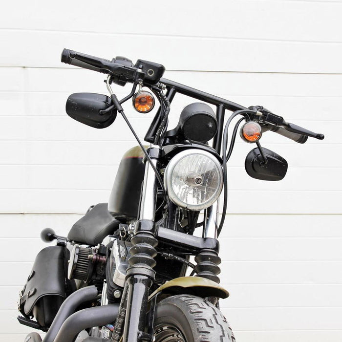 Two TC Bros. 1" Window Handlebars, one chrome and one black, featuring a distinctive rectangular center design inspired by TC Bros. Harley-Davidson styles, are displayed on a white background.