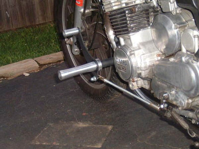 A TC Bros. Yamaha Maxim XJ750 Forward Controls Kit motorcycle parked on a driveway.