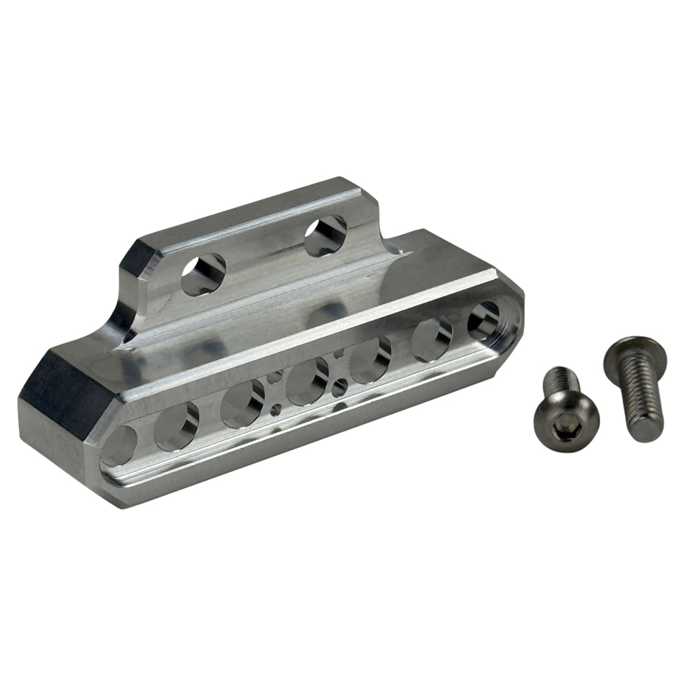 Two cylindrical motorcycle tachometer bezels from TC Bros., including the Pro Series 4 inch Gauge Relocation Bezel for Harley Davidson, in black and silver finishes with similar gauge faces featuring numbers and a red needle.