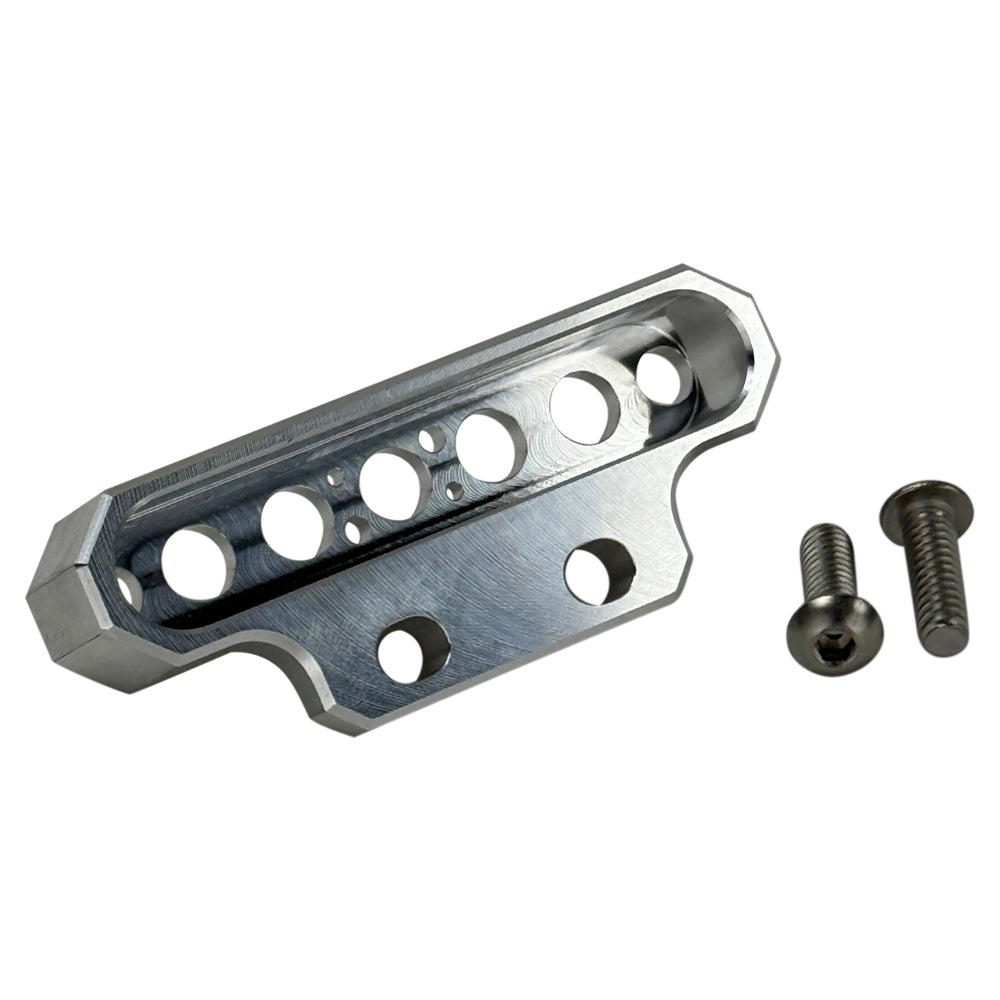 Two cylindrical motorcycle tachometer bezels from TC Bros., including the Pro Series 4 inch Gauge Relocation Bezel for Harley Davidson, in black and silver finishes with similar gauge faces featuring numbers and a red needle.