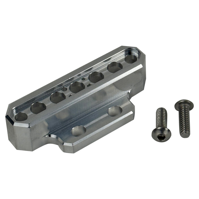 Two cylindrical motorcycle tachometer bezels from TC Bros., including the Pro Series 4 inch Gauge Relocation Bezel for Harley Davidson, in black and silver finishes with similar gauge faces featuring numbers and a red needle.