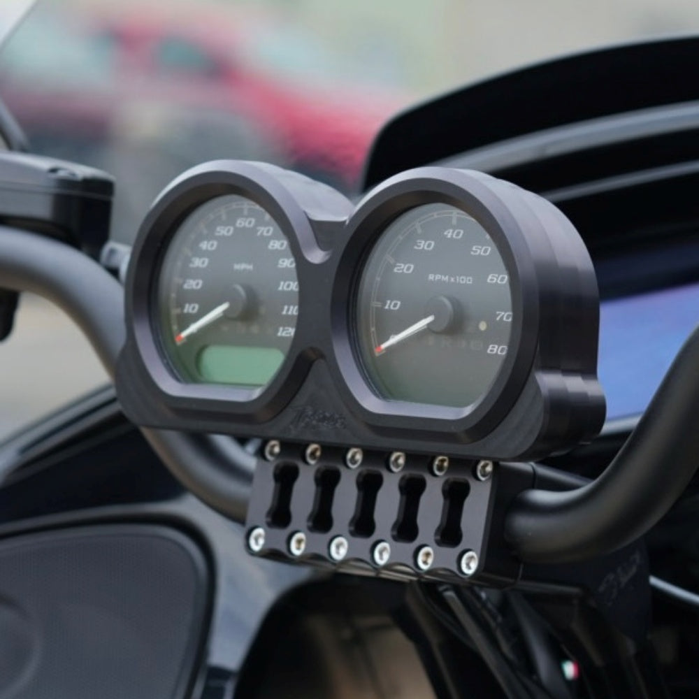Two TC Bros. Pro Series Gauge Relocation Bezels for 2014-2023 Harley-Davidson Road Glide are shown—machined billet aluminum with dual circular openings—in matte black and polished silver, against a white background.