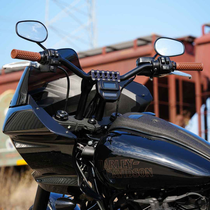 Two metallic TC Bros. Pro Series car mount bases for Harley Davidson M8 Softail, one in black anodized and the other in silver, feature rectangular cutouts and an engraved logo, blending form and function.