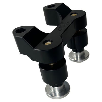 The TC Bros. Pro Series Riser Adapter for 2015-2023 Harley Road Glide, a sleek black and silver mechanical component with cylindrical parts and a solid frame, is perfect for enhancing your Harley Davidson.