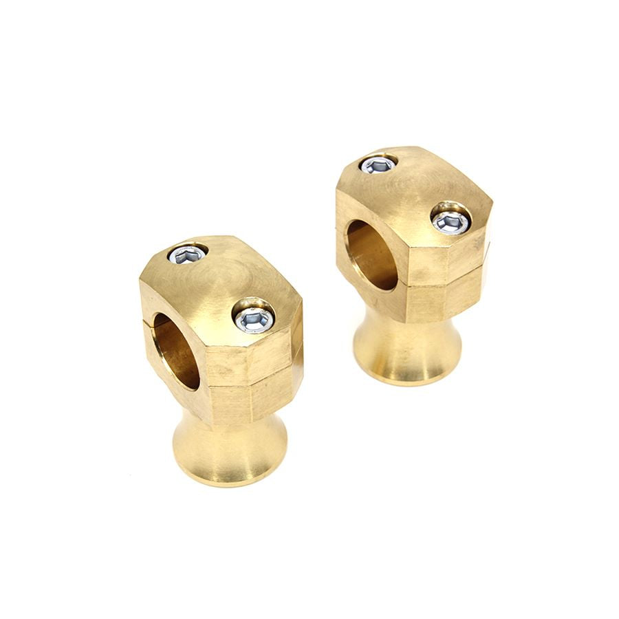 A pair of Wyatt Gatling 1" Diameter Shorty Style Brass Riser Set knobs on a white background.
